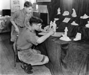Lord Rowallan, Chief Scout, visit to Chailey in 1955. Preparation of the Hound Patrol's stand. Ian Bell Patrol Leader and Stan (left) Second.